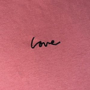 - pink h&m top with the word love embroidered on front